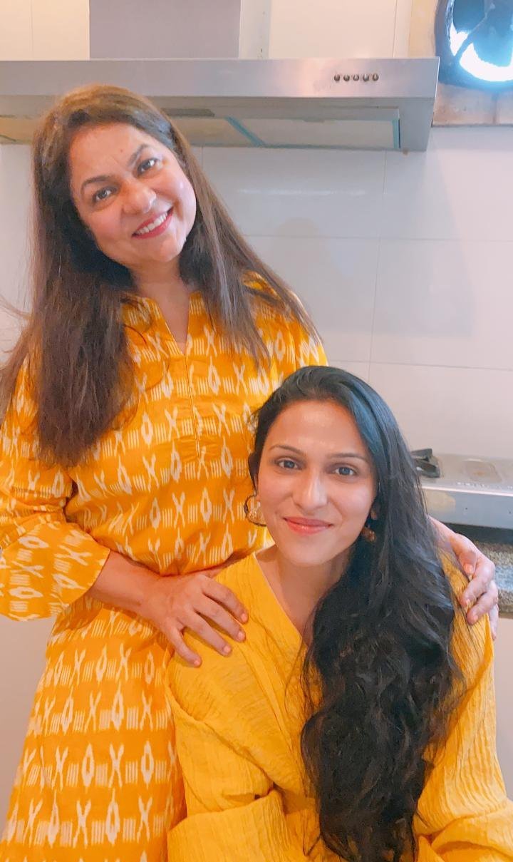 Mom and Nidhi together in their kitchen